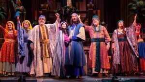 group of performers in costume on stage for Miracle of Christmas at Sight & Sound Theatre in Branson, Missouri, USA